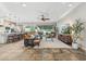 Spacious living room with a large sectional sofa, a modern entertainment center, and a seamless flow to the kitchen at 7503 S Roanoke St, Gilbert, AZ 85298