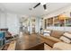 Open living room featuring hardwood floors and seamless access to multiple rooms at 7503 S Roanoke St, Gilbert, AZ 85298