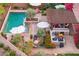 Stunning pool area with a built-in spa, sun loungers, and a covered outdoor kitchen with seating at 7503 S Roanoke St, Gilbert, AZ 85298