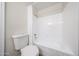 Bathroom featuring a toilet, shower, and white fixtures at 8023 N 49Th Ave, Glendale, AZ 85302