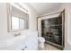 Updated bathroom with large vanity, modern lighting, and slate tile shower at 8023 N 49Th Ave, Glendale, AZ 85302