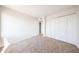 Bedroom featuring carpet flooring and a closet at 8023 N 49Th Ave, Glendale, AZ 85302