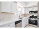 Modern kitchen featuring white cabinets and stainless steel appliances at 8023 N 49Th Ave, Glendale, AZ 85302