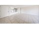 The living room features tile flooring, a large window, and neutral paint at 8023 N 49Th Ave, Glendale, AZ 85302