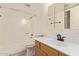 Bright bathroom features shower-tub combination with updated fixtures and a tiled floor at 8155 E Roosevelt St # 205, Scottsdale, AZ 85257