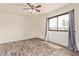 This bright bedroom features modern flooring and a large window at 8155 E Roosevelt St # 205, Scottsdale, AZ 85257