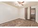 This bedroom features wood-look floors and a ceiling fan at 8155 E Roosevelt St # 205, Scottsdale, AZ 85257
