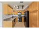 Functional kitchen featuring stainless steel appliances, bright cabinetry, and neutral countertops at 8155 E Roosevelt St # 205, Scottsdale, AZ 85257