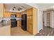Efficient kitchen featuring stainless steel appliances, bright cabinetry, neutral countertops and ample pantry storage at 8155 E Roosevelt St # 205, Scottsdale, AZ 85257