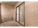 Private patio with sliding glass door leading into the living area at 8155 E Roosevelt St # 205, Scottsdale, AZ 85257