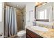 Bright bathroom with granite counters, modern fixtures, and a shower with decorative tile at 8315 E Devonshire Ave, Scottsdale, AZ 85251