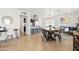 Open dining area featuring tile floors, modern lighting, and seamless access to the kitchen and living spaces at 8315 E Devonshire Ave, Scottsdale, AZ 85251