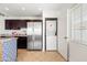Bright kitchen featuring stainless steel appliances, granite counters and in-unit washer and dryer at 8315 E Devonshire Ave, Scottsdale, AZ 85251