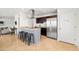 Modern kitchen featuring a breakfast bar with seating, stainless steel appliances, and open access to other spaces at 8315 E Devonshire Ave, Scottsdale, AZ 85251