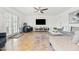 Spacious living room with comfortable seating, tile floors, and a sliding glass door to backyard at 8315 E Devonshire Ave, Scottsdale, AZ 85251