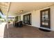 Covered patio features an outdoor dining area, ideal for relaxation and entertaining by the pool at 8315 E Devonshire Ave, Scottsdale, AZ 85251
