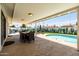 Inviting covered patio with ample space for dining and lounging by the refreshing pool at 8315 E Devonshire Ave, Scottsdale, AZ 85251