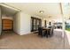 Spacious patio area with a dining table and chairs, offering a great view of the backyard at 8315 E Devonshire Ave, Scottsdale, AZ 85251