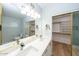 Bathroom featuring a dual vanity, a walk-in closet, and a separate toilet room at 909 W San Mateo Ct, Gilbert, AZ 85233