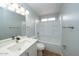 Bright bathroom featuring a shower-tub combination and modern fixtures at 909 W San Mateo Ct, Gilbert, AZ 85233