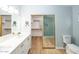 Bathroom featuring a dual vanity and access to a separate shower room at 909 W San Mateo Ct, Gilbert, AZ 85233