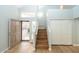 Spacious entryway with high ceilings, wood flooring, and a staircase leading to the upper level, creating an open feel at 909 W San Mateo Ct, Gilbert, AZ 85233