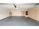 Clean garage with epoxy flooring, cabinets, and an updated water heater at 909 W San Mateo Ct, Gilbert, AZ 85233
