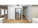 Spacious kitchen with stainless steel refrigerator and wood-look floors at 909 W San Mateo Ct, Gilbert, AZ 85233