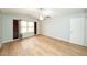 Large main bedroom with neutral walls, wood-look floors, a fan, and shuttered windows at 909 W San Mateo Ct, Gilbert, AZ 85233