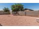 Backyard with desert landscaping and a fountain at 9224 W Raymond St, Tolleson, AZ 85353