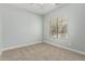 Neutral bedroom with carpet, ceiling fan and natural light at 9224 W Raymond St, Tolleson, AZ 85353