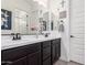 Bright bathroom featuring a double sink vanity with sleek countertops and modern fixtures at 9448 W Villa Hermosa --, Peoria, AZ 85383