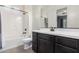 Well-lit bathroom with a white tub, dark vanity, and modern fixtures throughout at 9448 W Villa Hermosa --, Peoria, AZ 85383