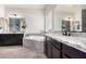 Elegant bathroom featuring granite counters, dark wood cabinets, jetted tub, and wood-look tile flooring at 9448 W Villa Hermosa --, Peoria, AZ 85383
