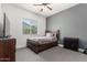 Bedroom with neutral gray walls, a window with blinds, and a comfortable bed at 9448 W Villa Hermosa --, Peoria, AZ 85383