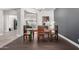 Stylish dining room with rustic wood table, modern lighting, and views into other living spaces at 9448 W Villa Hermosa --, Peoria, AZ 85383
