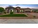Beautiful single-Gathering home with a well-manicured lawn, desert landscaping, and a charming stone-accented entrance at 9448 W Villa Hermosa --, Peoria, AZ 85383