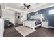Primary bedroom offers wood floors, white trim, an accent wall, and tray ceiling with recessed lighting at 9448 W Villa Hermosa --, Peoria, AZ 85383