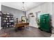 Bright office space with hardwood floors, a chandelier, and a VaultPro gun safe at 9448 W Villa Hermosa --, Peoria, AZ 85383