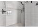 Tiled shower with upgraded shower head and decorative accent tiles along with recessed niche at 9448 W Villa Hermosa --, Peoria, AZ 85383
