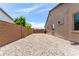 Spacious side yard with gravel, a brick wall, and gate at 9448 W Villa Hermosa --, Peoria, AZ 85383