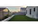 This backyard has an artificial lawn, a low wall separating flower beds, and block walls for privacy at 10351 W Deanna Dr, Peoria, AZ 85382