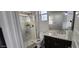 Bathroom highlighting a glass door shower, single sink with marble countertop, and neutral finishes at 10351 W Deanna Dr, Peoria, AZ 85382