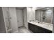 This bathroom features double sinks, dark cabinets, walk-in shower, and tiled floors for spa-like experience at 10351 W Deanna Dr, Peoria, AZ 85382