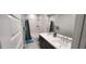 Bathroom featuring dual sinks, a marble countertop, and a shower with a curtain at 10351 W Deanna Dr, Peoria, AZ 85382