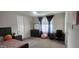 Bedroom featuring a bed, dresser, desk, and window with shutters for natural light at 10351 W Deanna Dr, Peoria, AZ 85382
