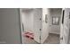 Hallway view showcasing neutral walls, carpet, and white doors leading to rooms at 10351 W Deanna Dr, Peoria, AZ 85382