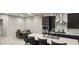 Modern kitchen with stainless steel appliances, a large island, and an adjacent dining area at 10351 W Deanna Dr, Peoria, AZ 85382
