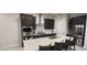 Contemporary kitchen boasting stainless steel appliances, a center island, and dark wood cabinets at 10351 W Deanna Dr, Peoria, AZ 85382