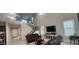 Bright living room features tile flooring, tall ceilings, staircase, and media center for entertainment at 10351 W Deanna Dr, Peoria, AZ 85382